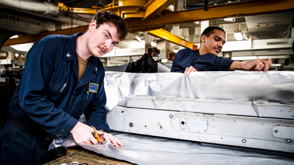 USS George Washington Sailors maintain aircraft