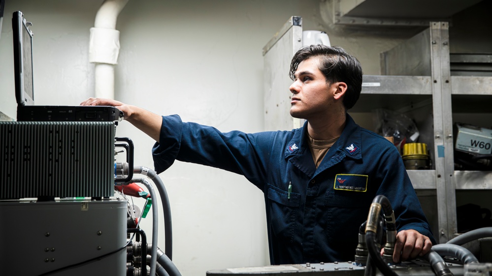 USS George Washington Sailors maintain aircraft