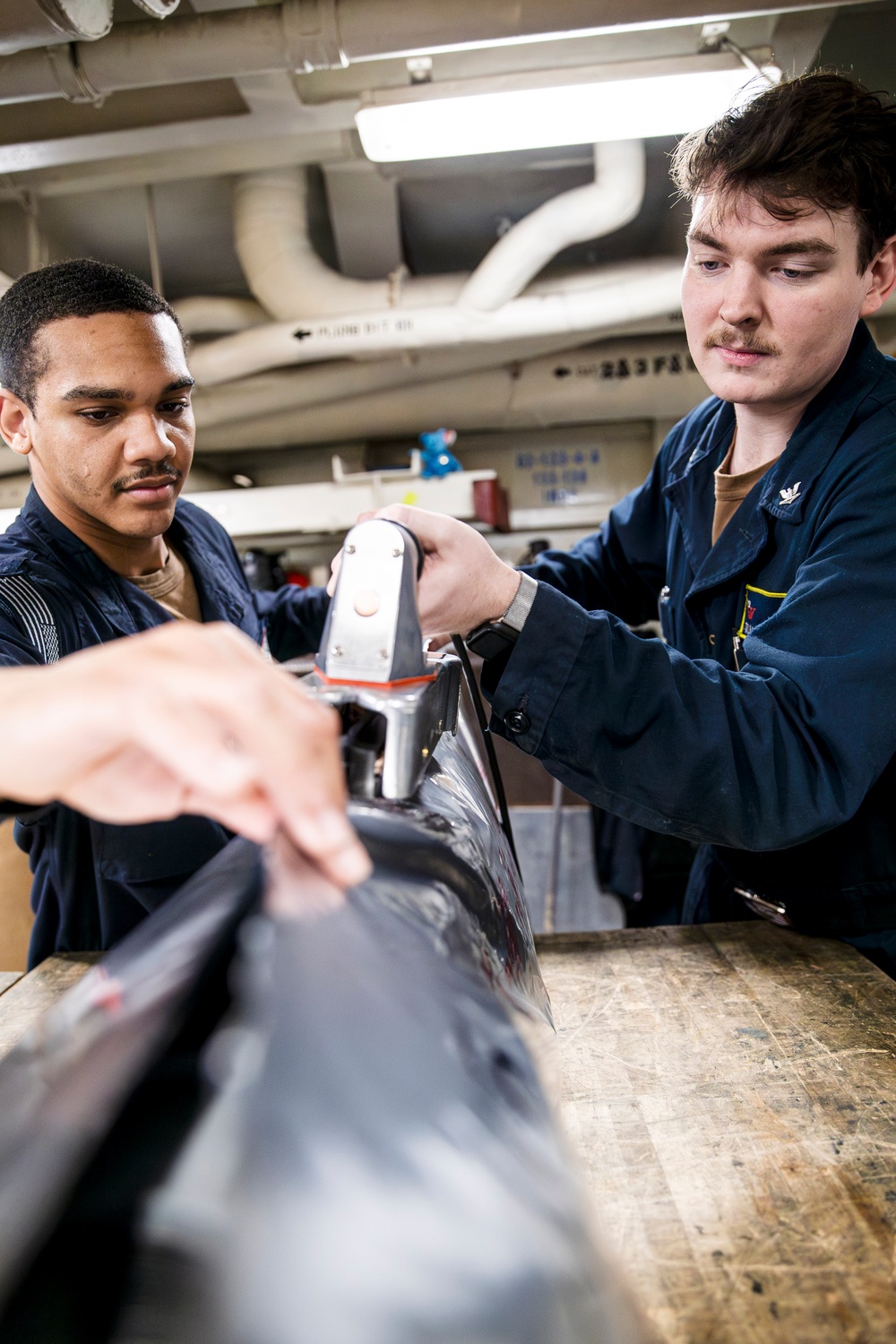 USS George Washington Sailors maintain aircraft