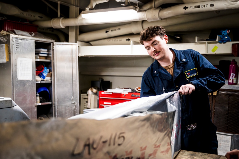 USS George Washington Sailors maintain aircraft