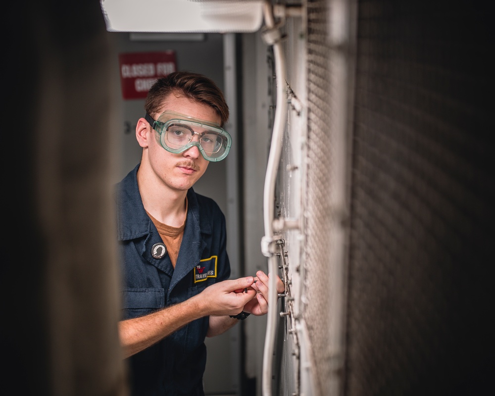 USS George Washington Sailors perform fan coil unit maintenance