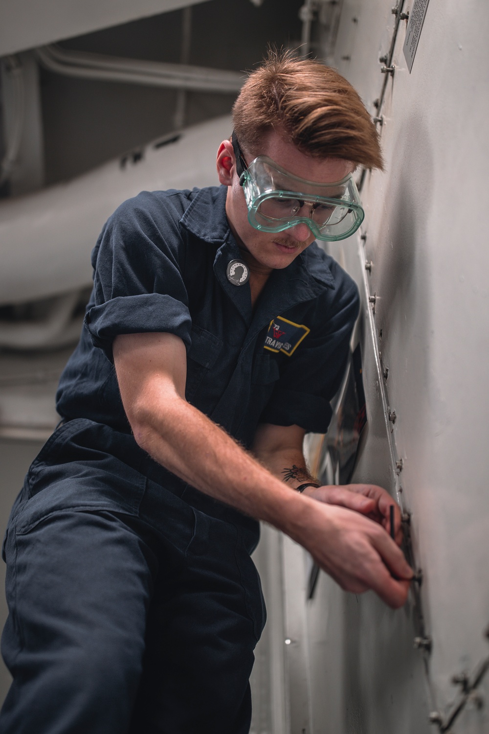 USS George Washington Sailors perform fan coil unit maintenance