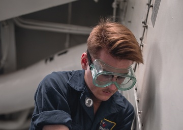 USS George Washington Sailors perform fan coil unit maintenance