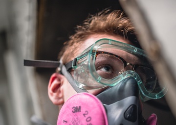 USS George Washington Sailors perform fan coil unit maintenance