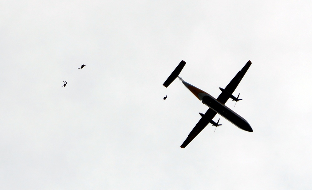 Members of the U.S. Army Parachute Team perform a demonstration jump into Nissan Stadium Sunday, November 17th, 2024.