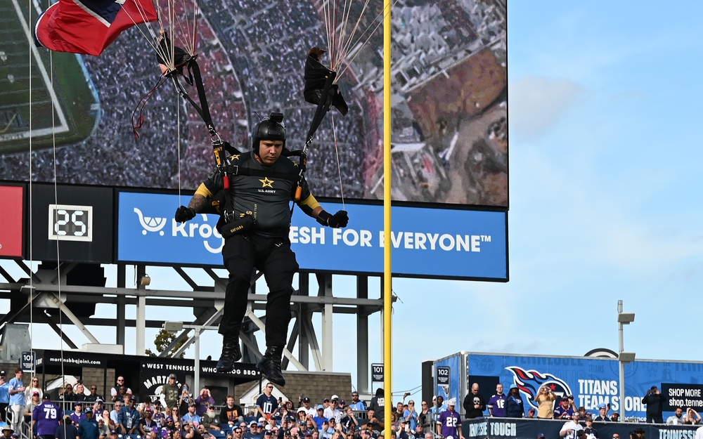 Members of the U.S. Army Parachute Team perform a demonstration jump into Nissan Stadium Sunday, November 17th, 2024.