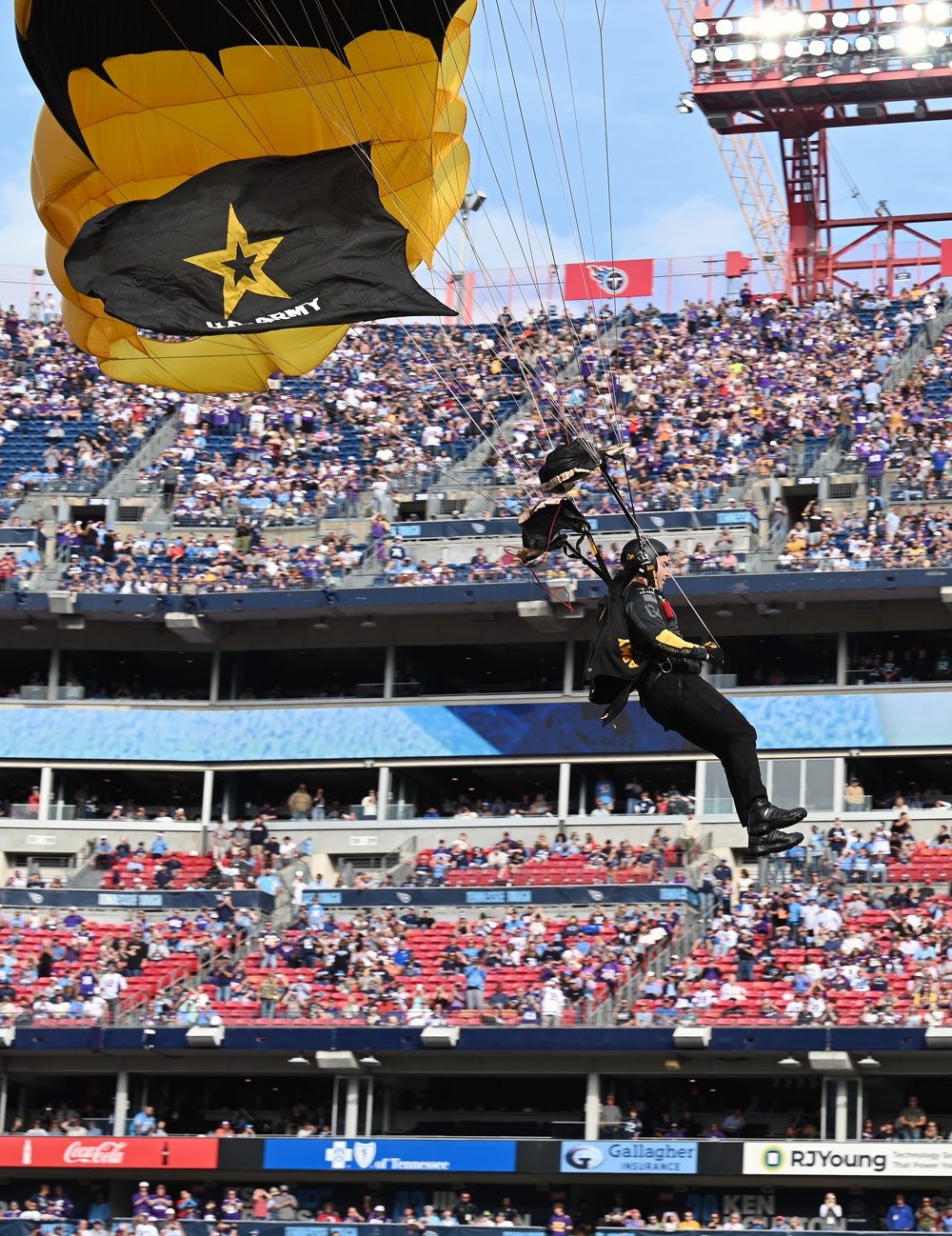 Members of the U.S. Army Parachute Team perform a demonstration jump into Nissan Stadium Sunday, November 17th, 2024.