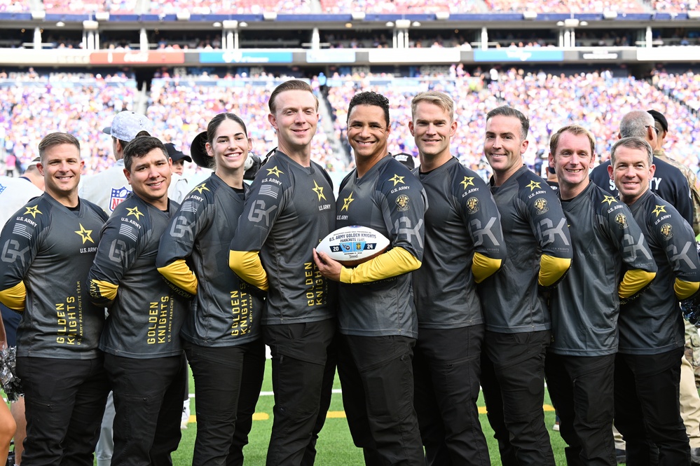 Members of the U.S. Army Parachute Team perform a demonstration jump into Nissan Stadium Sunday, November 17th, 2024.