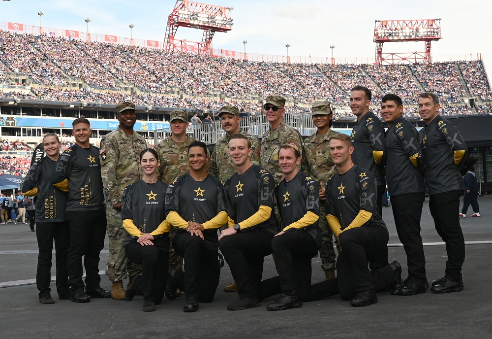 Members of the U.S. Army Parachute Team perform a demonstration jump into Nissan Stadium Sunday, November 17th, 2024.