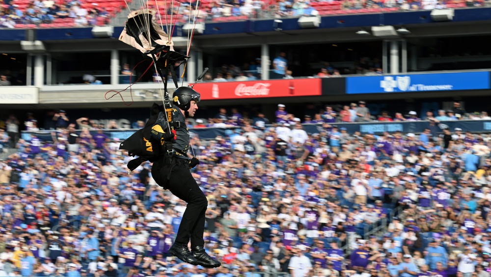 Members of the U.S. Army Parachute Team perform a demonstration jump into Nissan Stadium Sunday, November 17th, 2024.