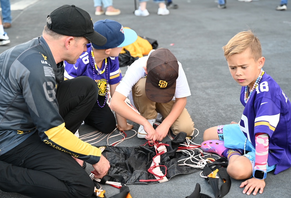 Members of the U.S. Army Parachute Team perform a demonstration jump into Nissan Stadium Sunday, November 17th, 2024.