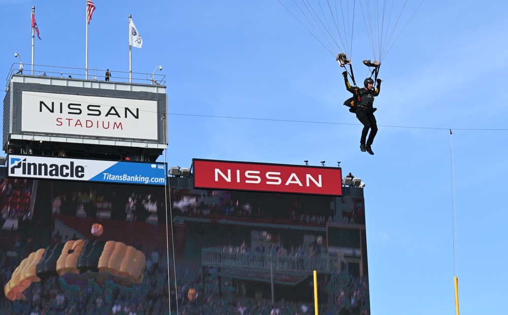 Members of the U.S. Army Parachute Team perform a demonstration jump into Nissan Stadium Sunday, November 17th, 2024.