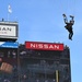 Members of the U.S. Army Parachute Team perform a demonstration jump into Nissan Stadium Sunday, November 17th, 2024.