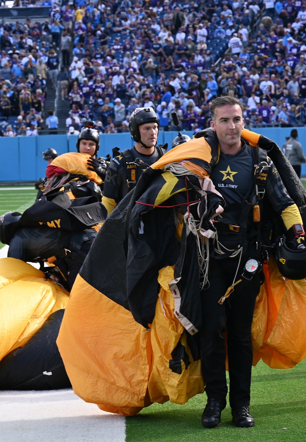 Members of the U.S. Army Parachute Team perform a demonstration jump into Nissan Stadium Sunday, November 17th, 2024.