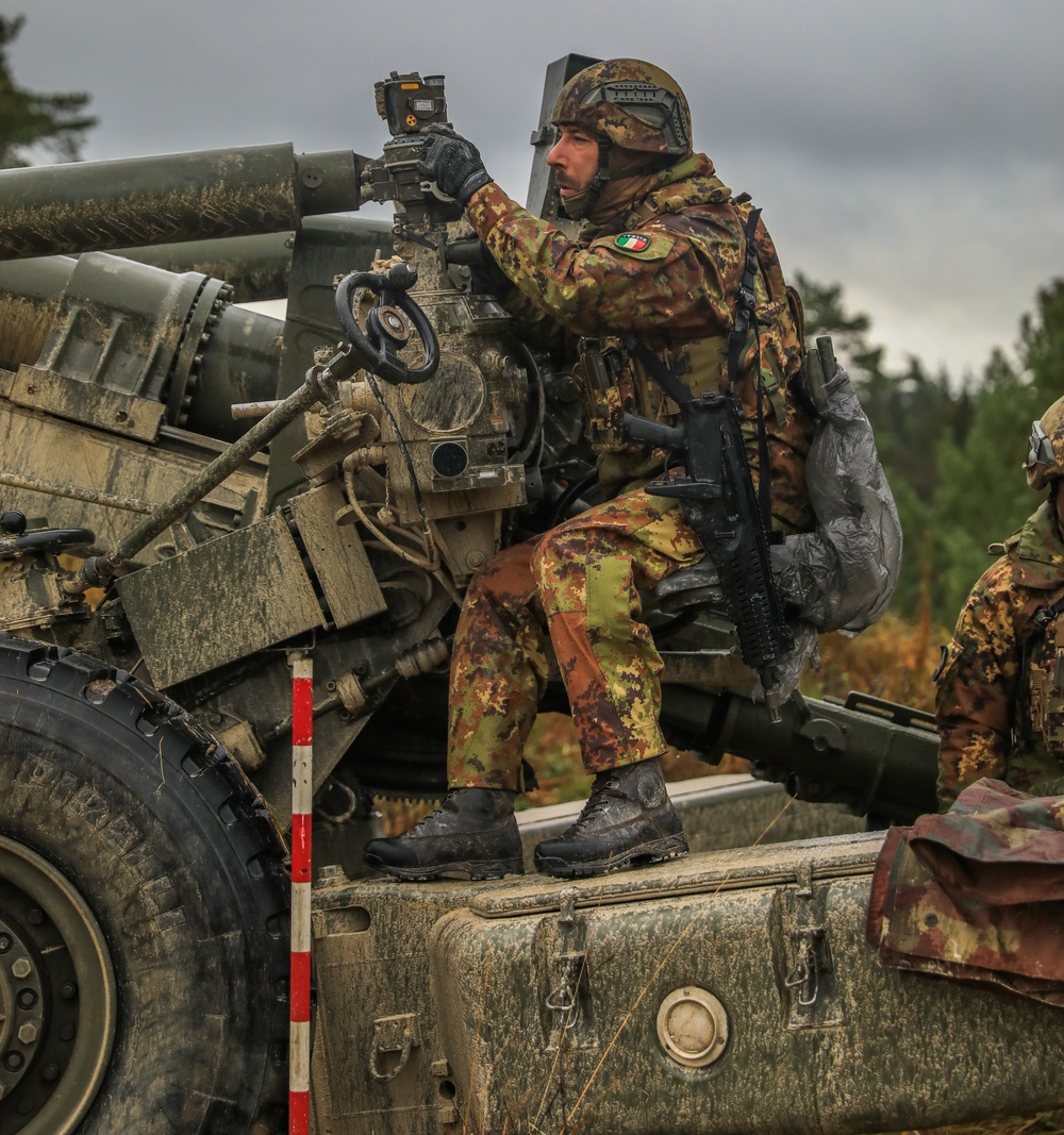 Italian soldiers conduct FH70 live fire exercise as part of the Dynamic Front 25