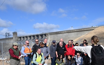 Public Affairs Specialist directs group photo during S.A.M.E tour