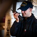 Nimitz Sailor Uses a Radio