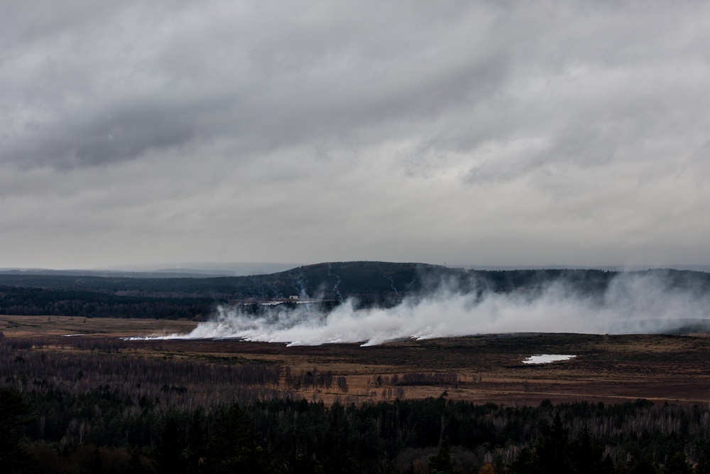 Artillery rounds fired during live fire training land in the impact area during Exercise Dynamic Front 25