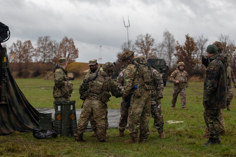 2nd Cavalry Regiment Field Artillery Squadron Soldiers greet their Georgian counterparts during Exercise Dynamic Front 25