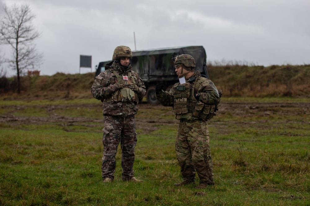 U.S. Soldier shares training expertise with their Georgian counterpart during Exercise Dynamic Front 25