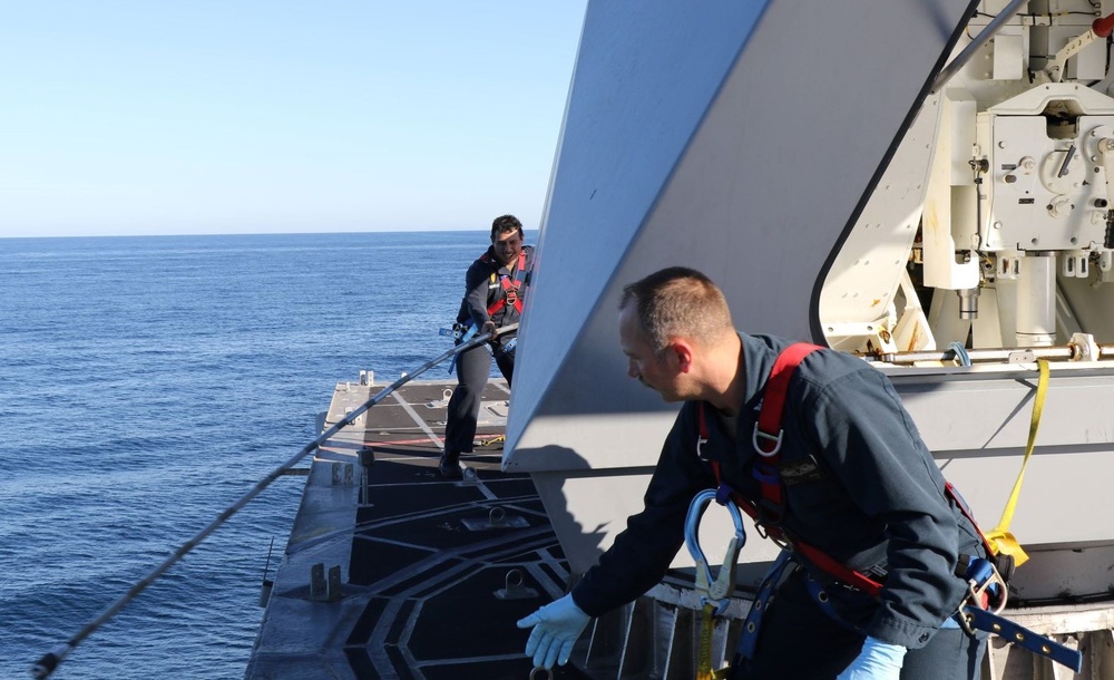 USS Tulsa (LCS 16) Sailors Conduct MK110 Maintenance