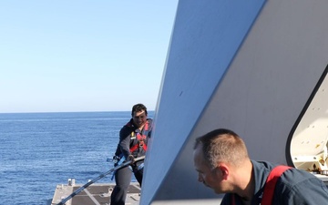 USS Tulsa (LCS 16) Sailors Conduct MK110 Maintenance