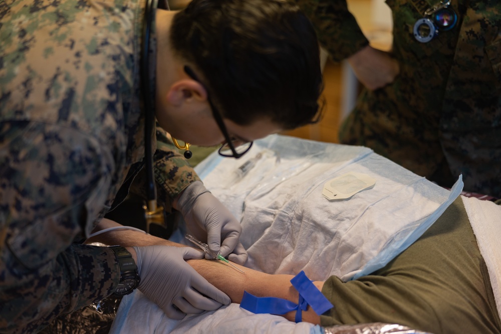 U.S. Navy Corpsman Conduct Practical Application of TCCC