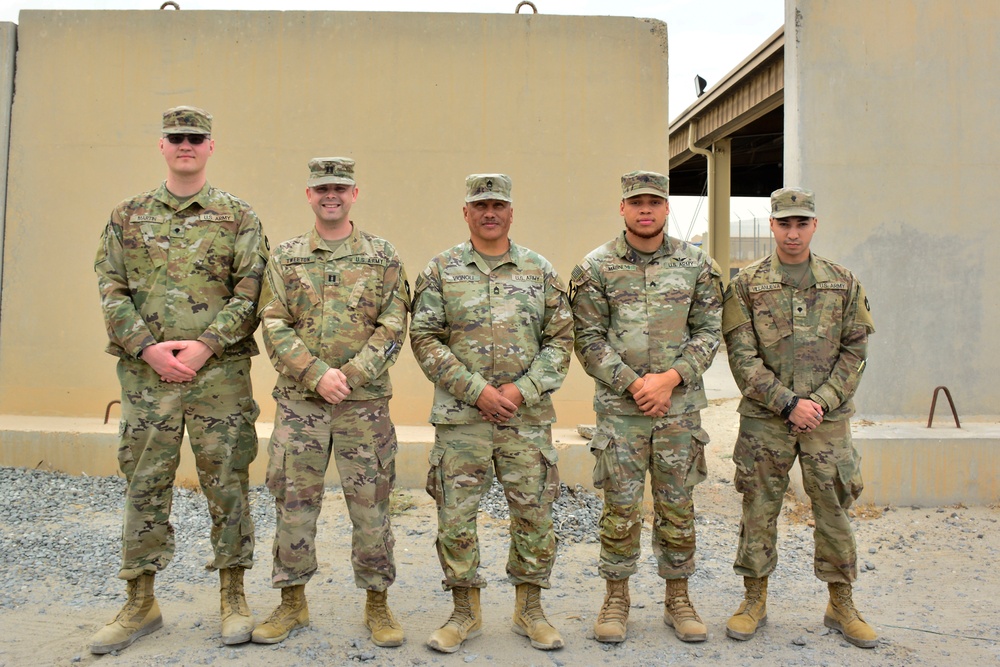 Soldiers stand for section photo.