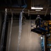 Nimitz Sailor Removes AFFF Plastic Covers