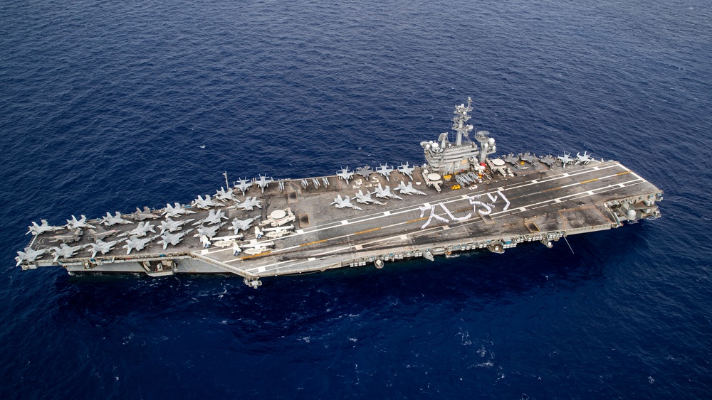 USS George Washington Sailors greet Japan with flight deck message