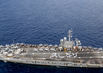 USS George Washington Sailors greet Japan with flight deck message