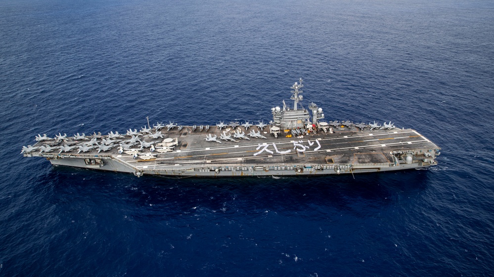 USS George Washington Sailors greet Japan with flight deck message