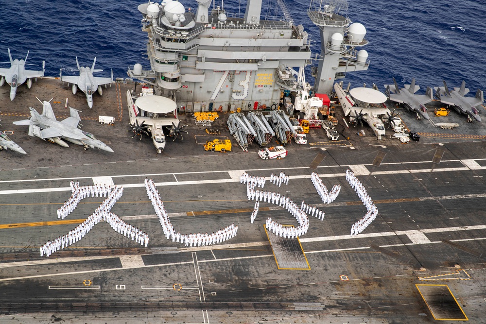 USS George Washington Sailors greet Japan with flight deck message