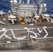 USS George Washington Sailors greet Japan with flight deck message