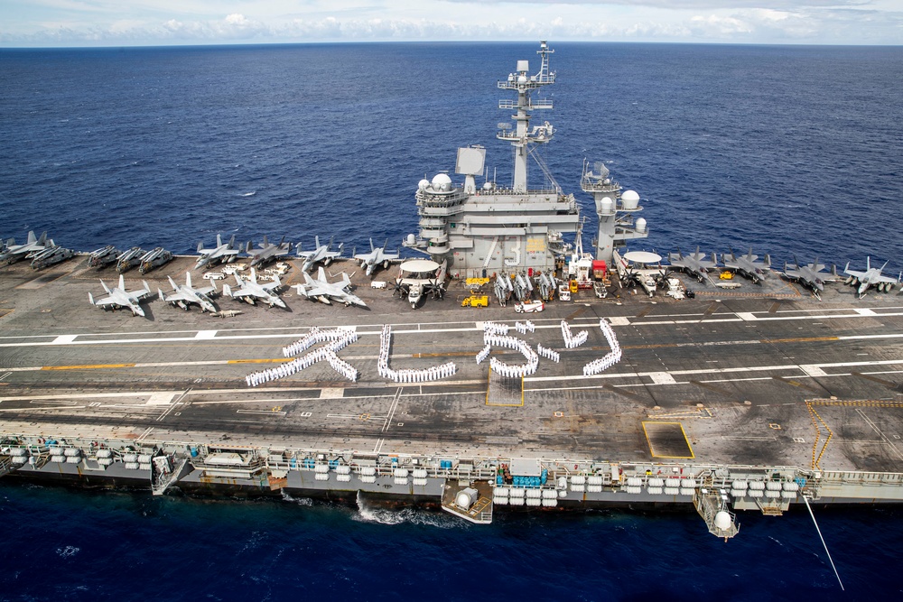 USS George Washington Sailors greet Japan with flight deck message