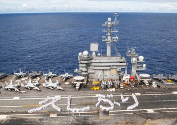 USS George Washington Sailors greet Japan with flight deck message