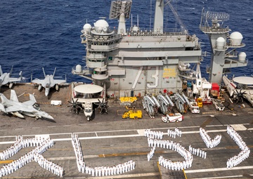 USS George Washington Sailors greet Japan with flight deck message