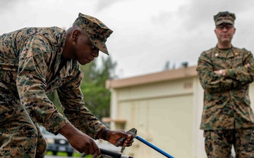 18th CES Airmen and 3DMEDBN Sailors handle Okinawan snakes