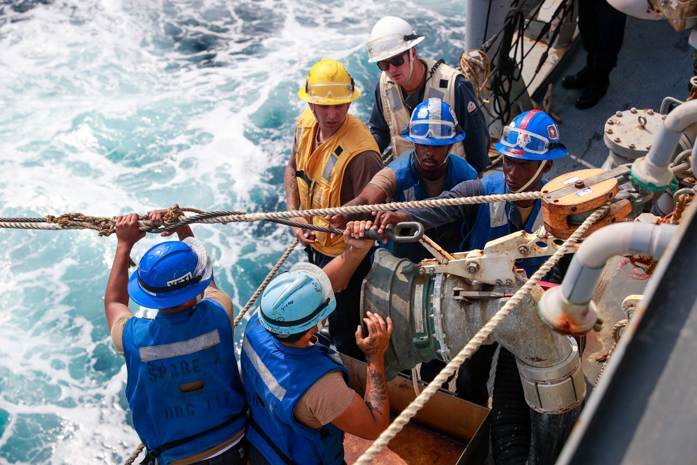 Michael Murphy conducts a fueling-at-sea with Abraham Lincoln