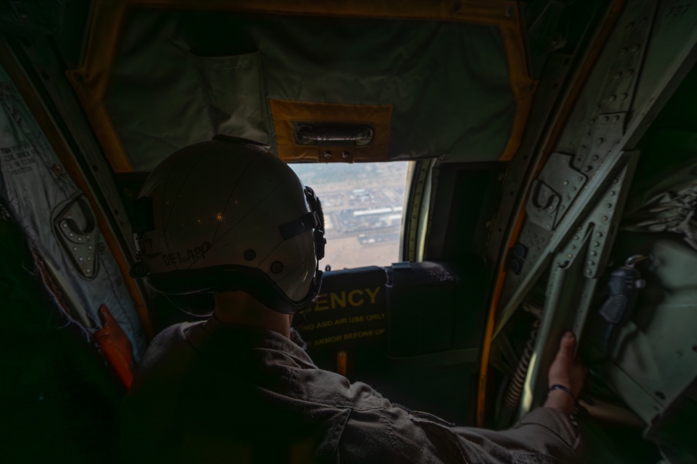 U.S. Marine Corps Loadmaster Watches VM-22 During Flyover