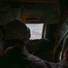 U.S. Marine Corps Loadmaster Watches VM-22 During Flyover