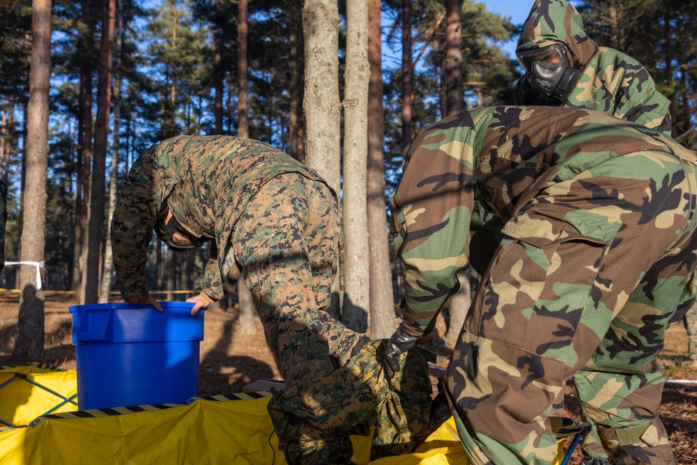 U.S. Marines with Chemical Biological Radiological and Nuclear Defense Conduct Decontamination Training