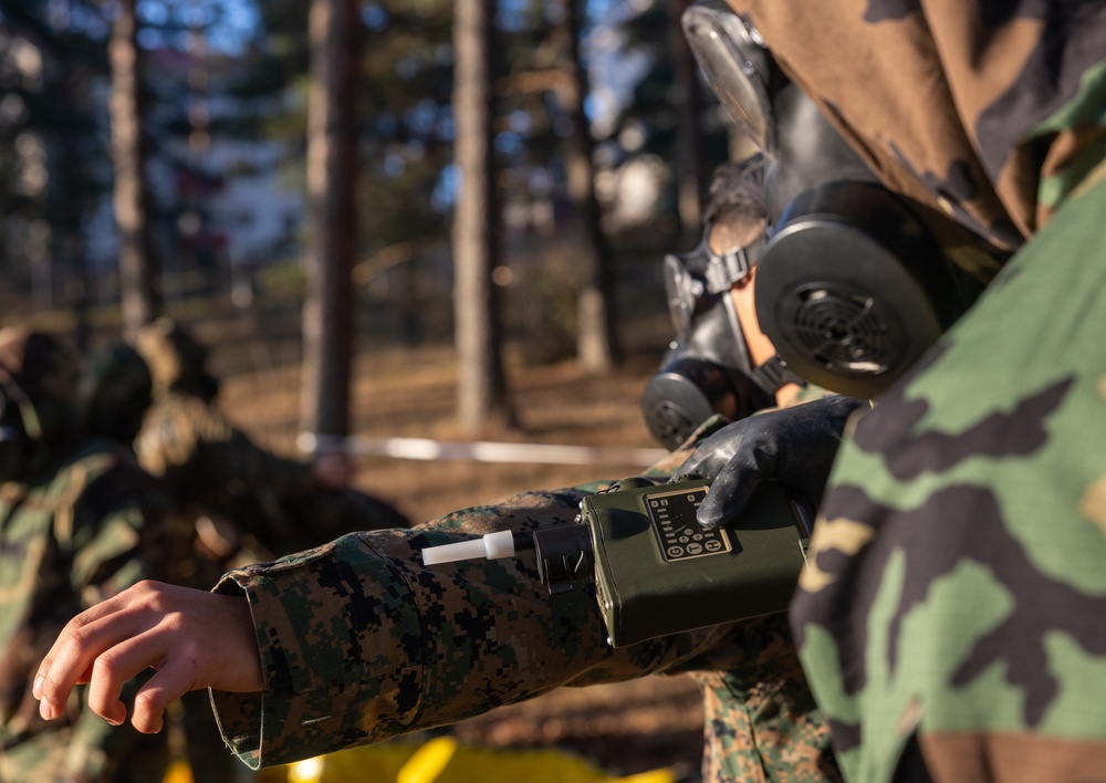 U.S. Marines with Chemical Biological Radiological and Nuclear Defense Conduct Decontamination Training