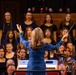 A Choir Director from the Granite School District Conducts at the 69th Annual Veterans Day Concert