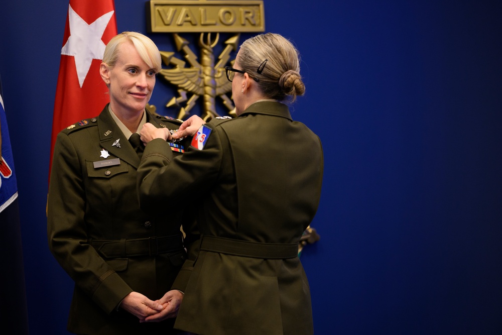 U.S. Army Astronaut MAJ Kathleen Rubins is awarded the Basic Aviator Badge with the Astronaut Device and Space Operations Badge at the Pentagon