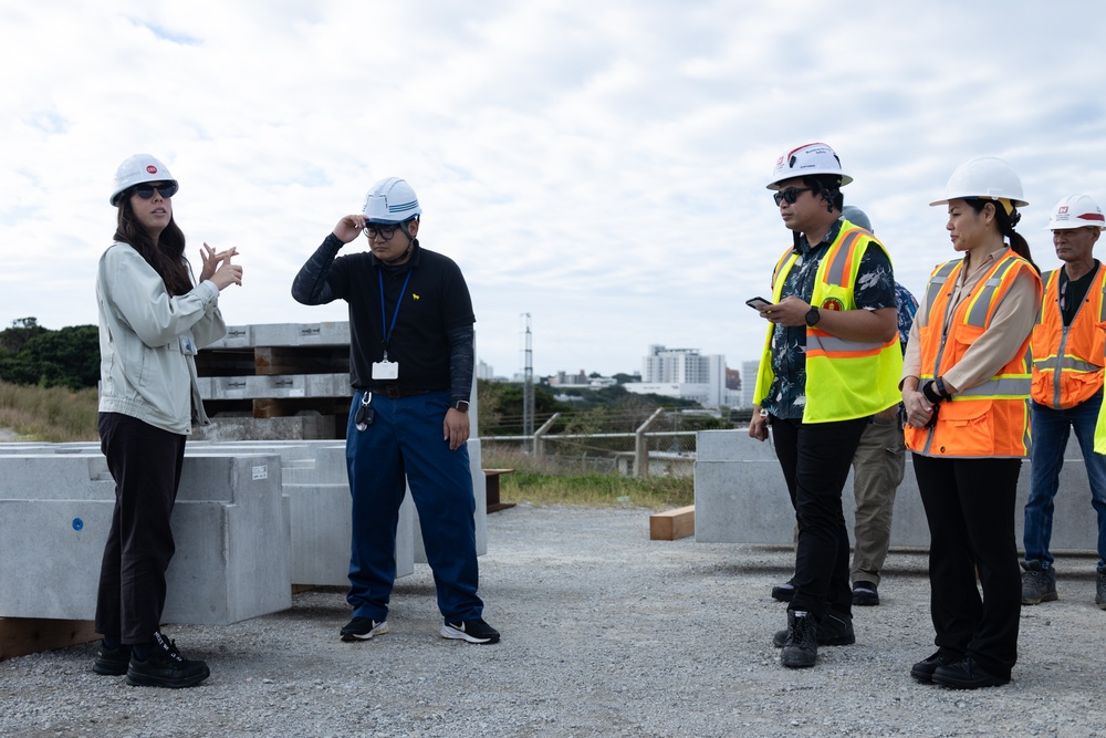 Members of the Defense Policy Review Initiative, U.S. Army Corps of Engineers, and the Okinawa Defense Bureau tour construction for new base housing