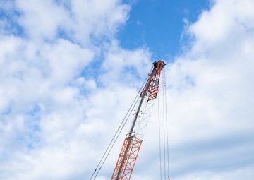 Members of the Defense Policy Review Initiative, U.S. Army Corps of Engineers, and the Okinawa Defense Bureau tour construction for new base housing