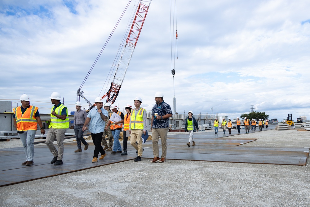 Members of the Defense Policy Review Initiative, U.S. Army Corps of Engineers, and the Okinawa Defense Bureau tour construction for new base housing