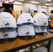 Members of the Defense Policy Review Initiative, U.S. Army Corps of Engineers, and the Okinawa Defense Bureau tour construction for new base housing