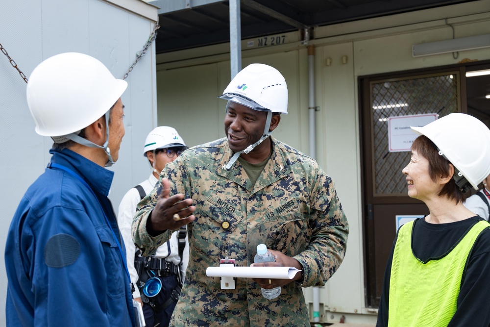 Members of the Defense Policy Review Initiative, U.S. Army Corps of Engineers, and the Okinawa Defense Bureau tour construction for new base housing